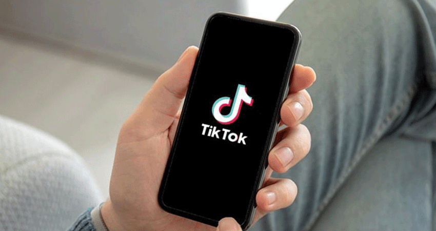 TikTok search ads guy holding phone feature