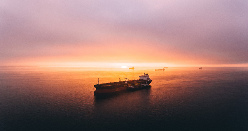cargo freighter at sunset feature